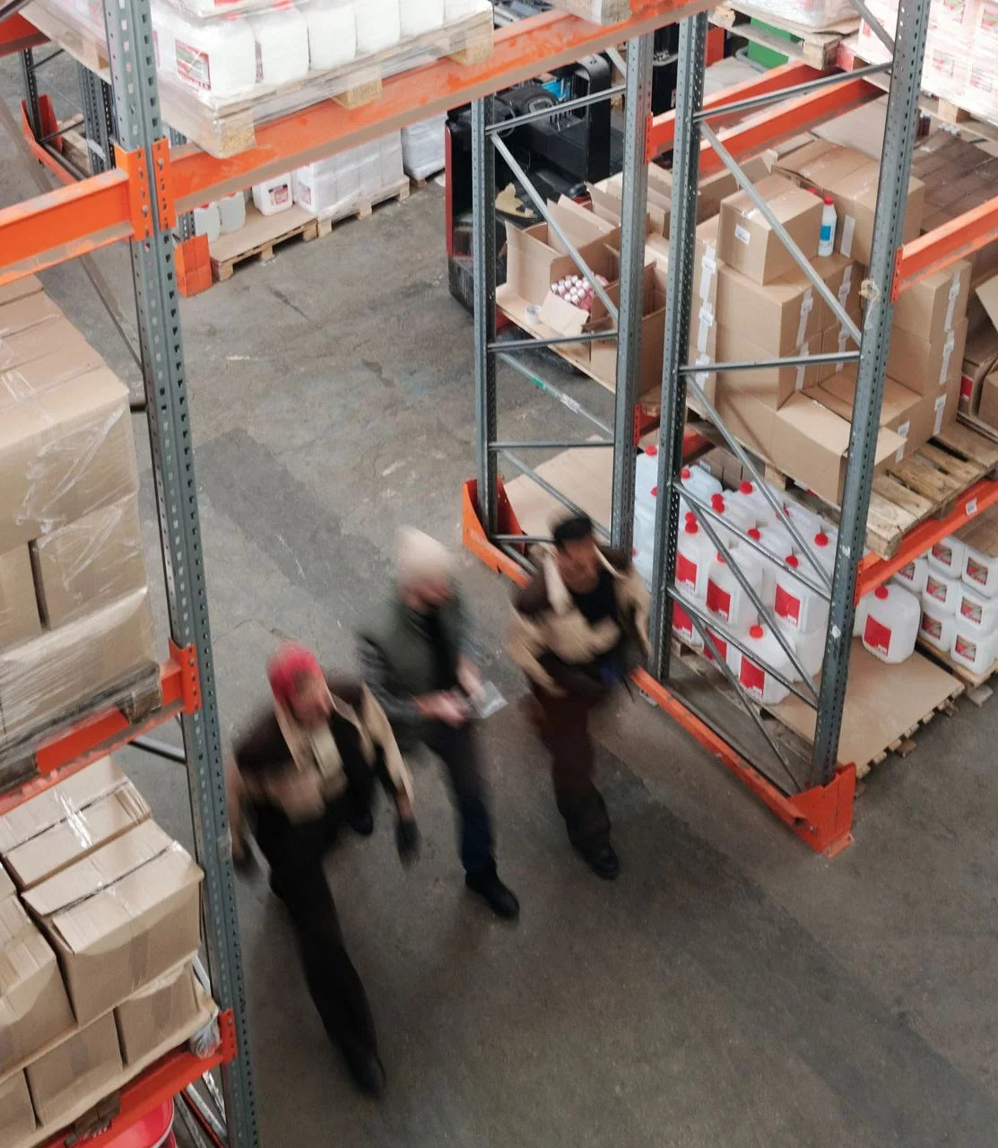 Warehouse aisle with packed orders on shelves